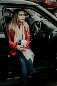 a woman sitting in a car