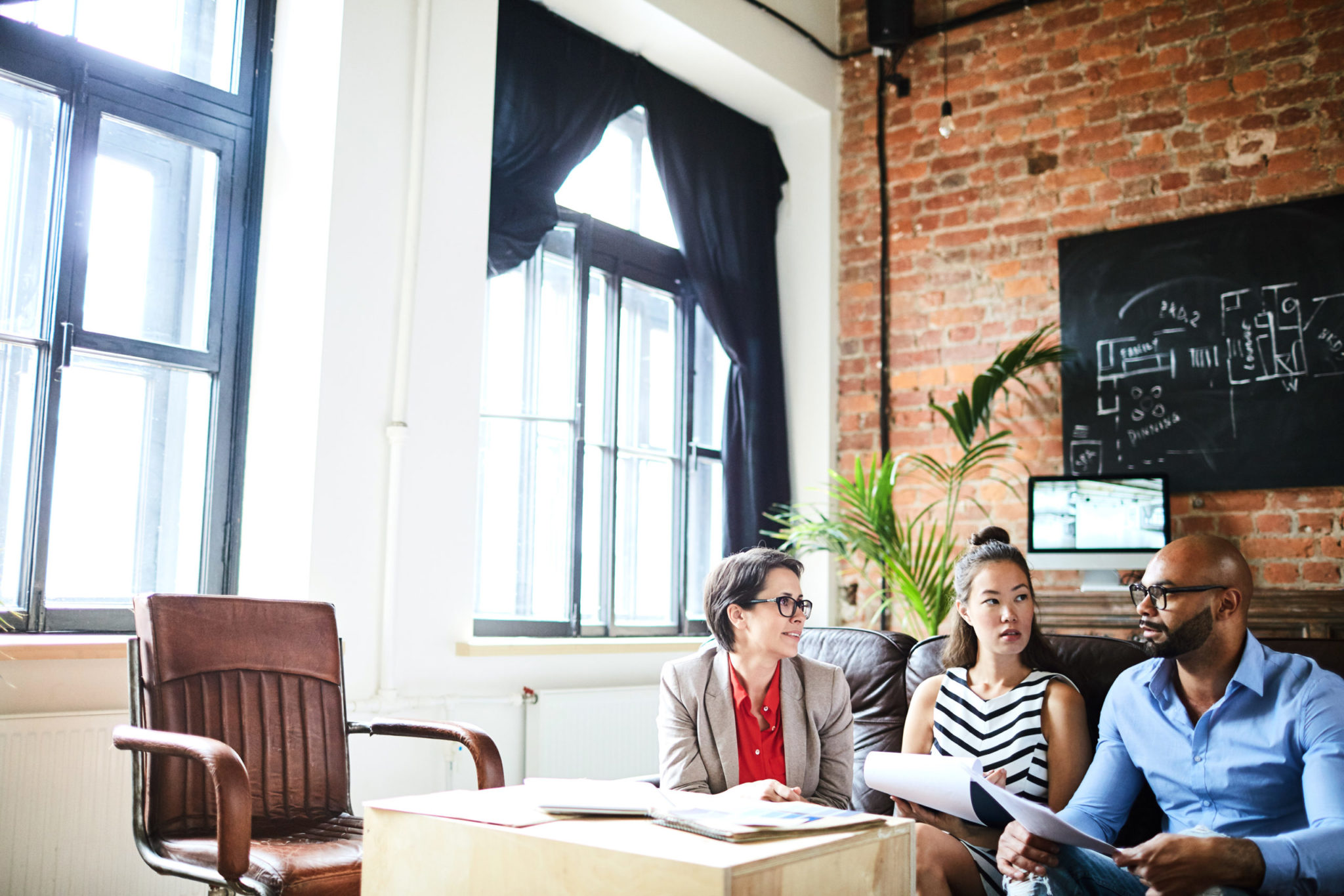 a group of people sitting at a table in a room