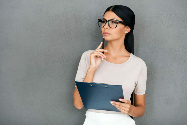 a person with glasses and a laptop