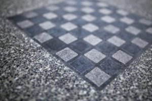a close-up of a black tile floor
