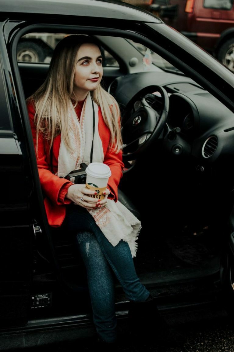 a woman sitting in a car