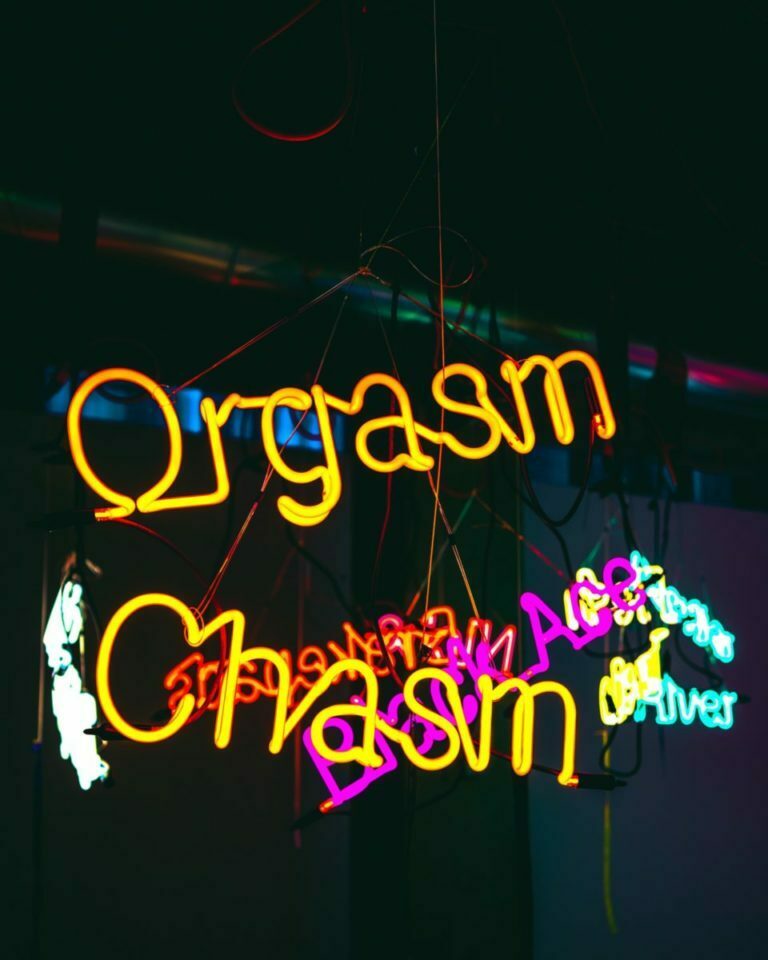 neon sign with yellow text
