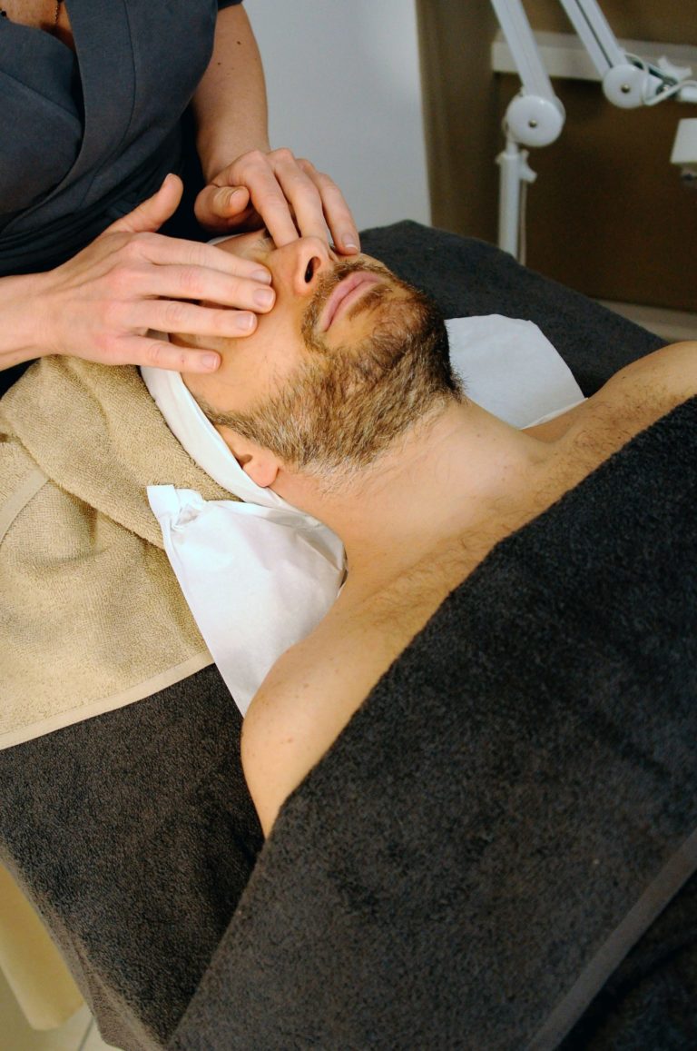 a person lying on the back with the hands on the head
