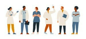 a group of people wearing white lab coats