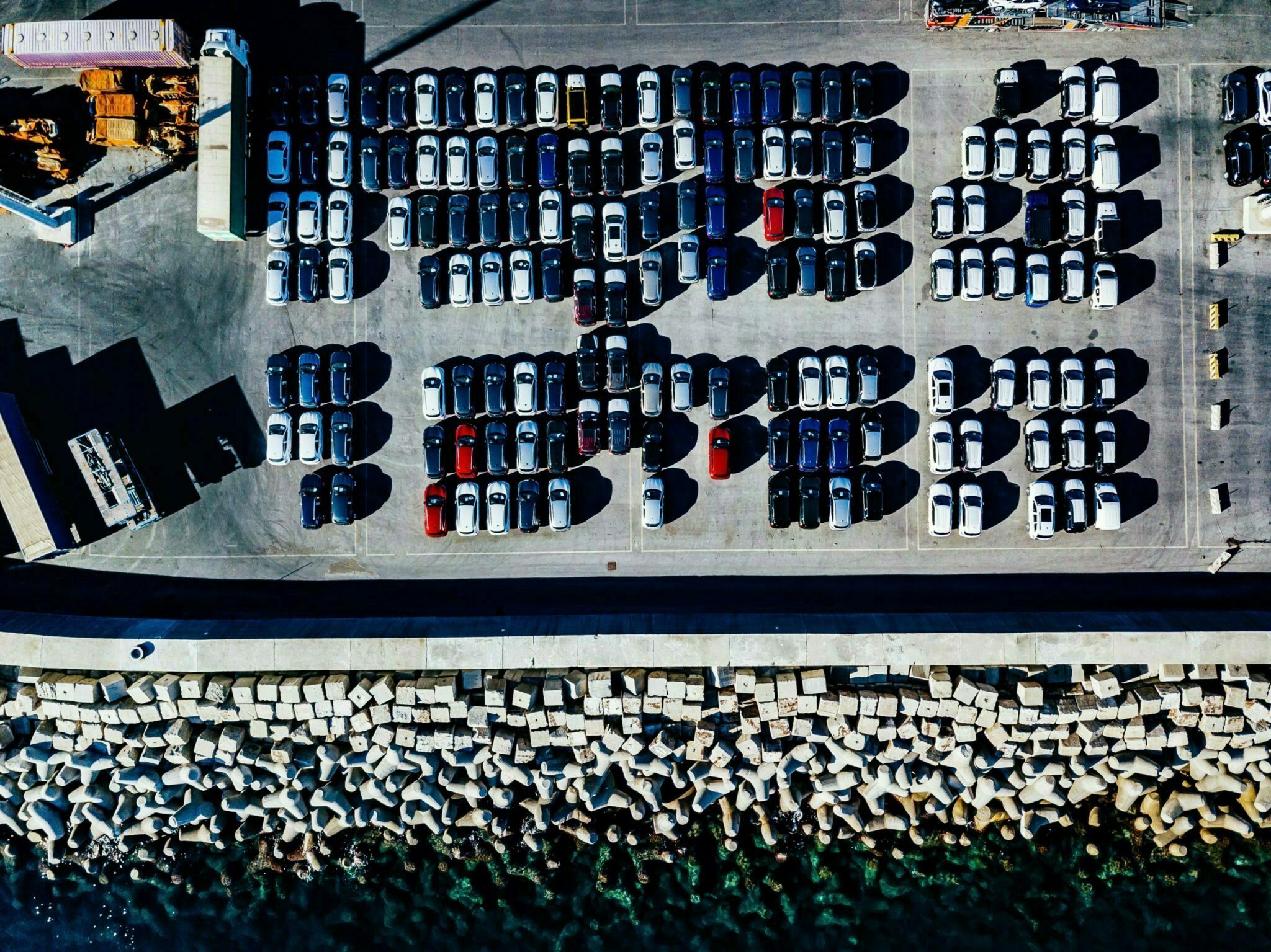 Aerial view of used cars lined up in the port