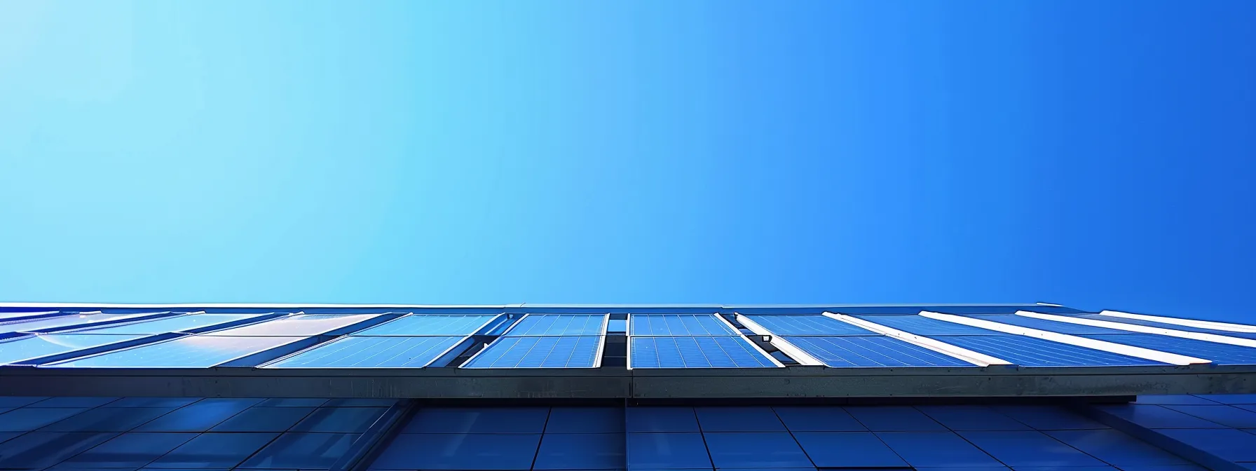 a modern solar panel installation on a rooftop under a clear blue sky.